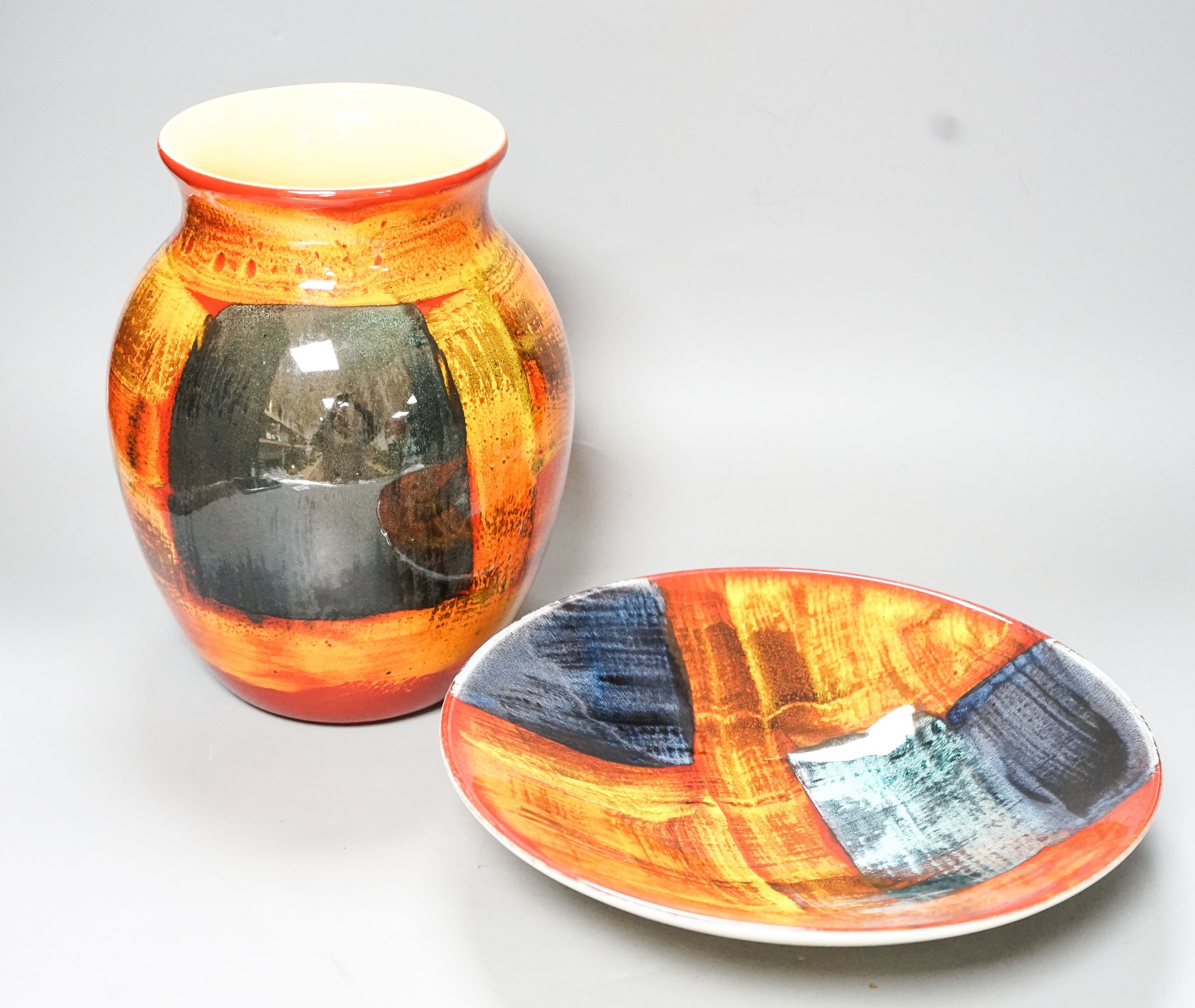 A Poole pottery vase and a shallow dish 27cm